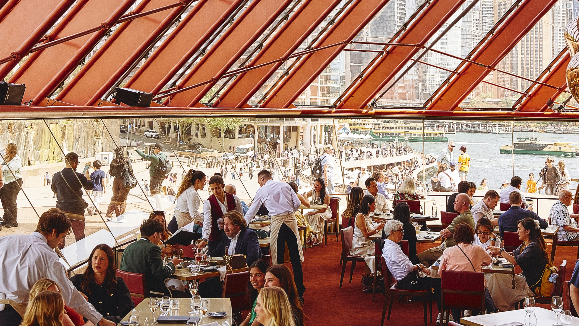 The light-filled, harbourside dining room of Bennelong, Sydney, open on Christmas Day 2025 