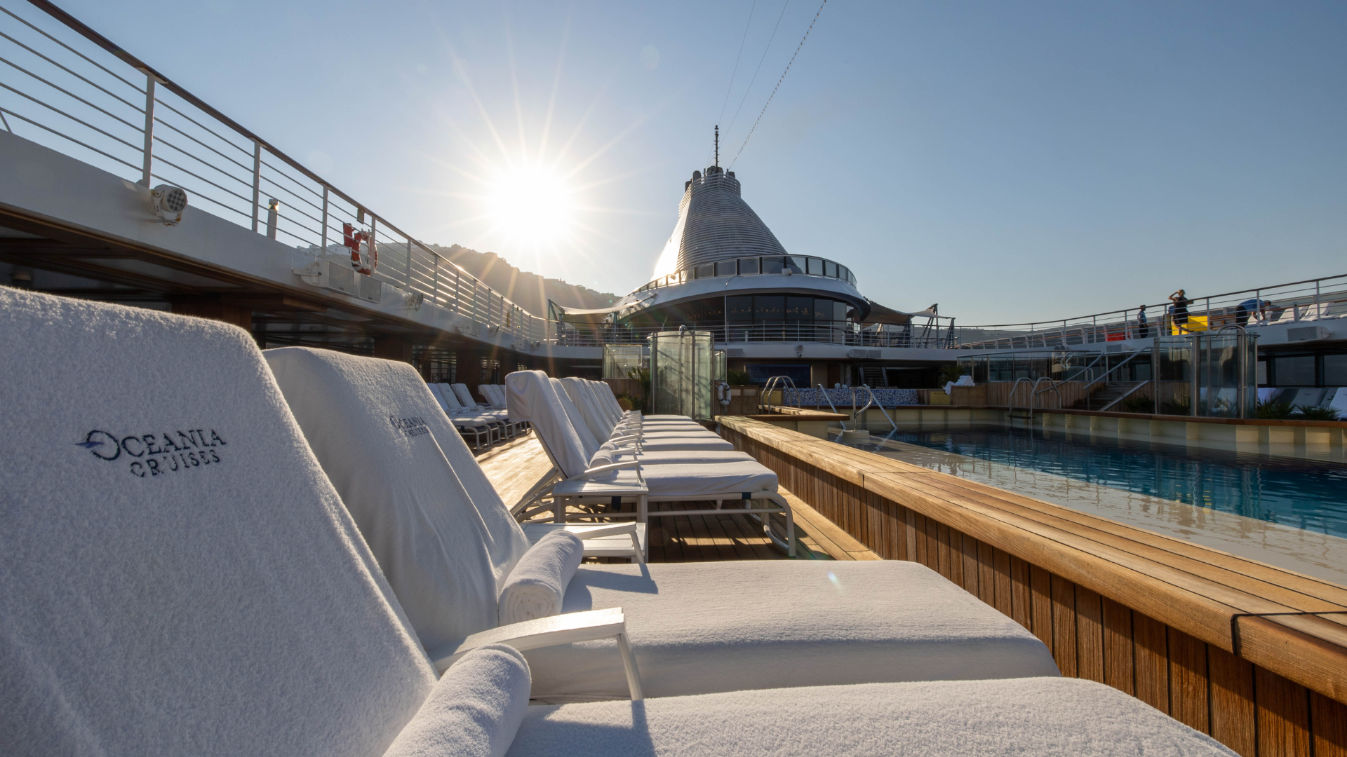 soak up some sun by the pool on this  luxury cruise ship