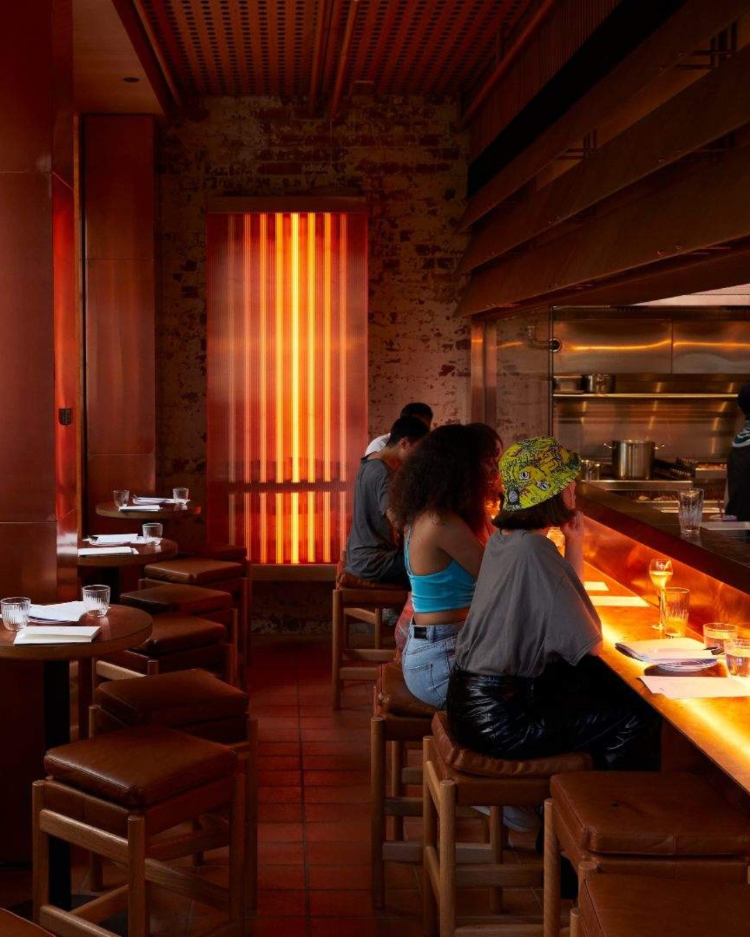The neon-tinged dining room at BKK 