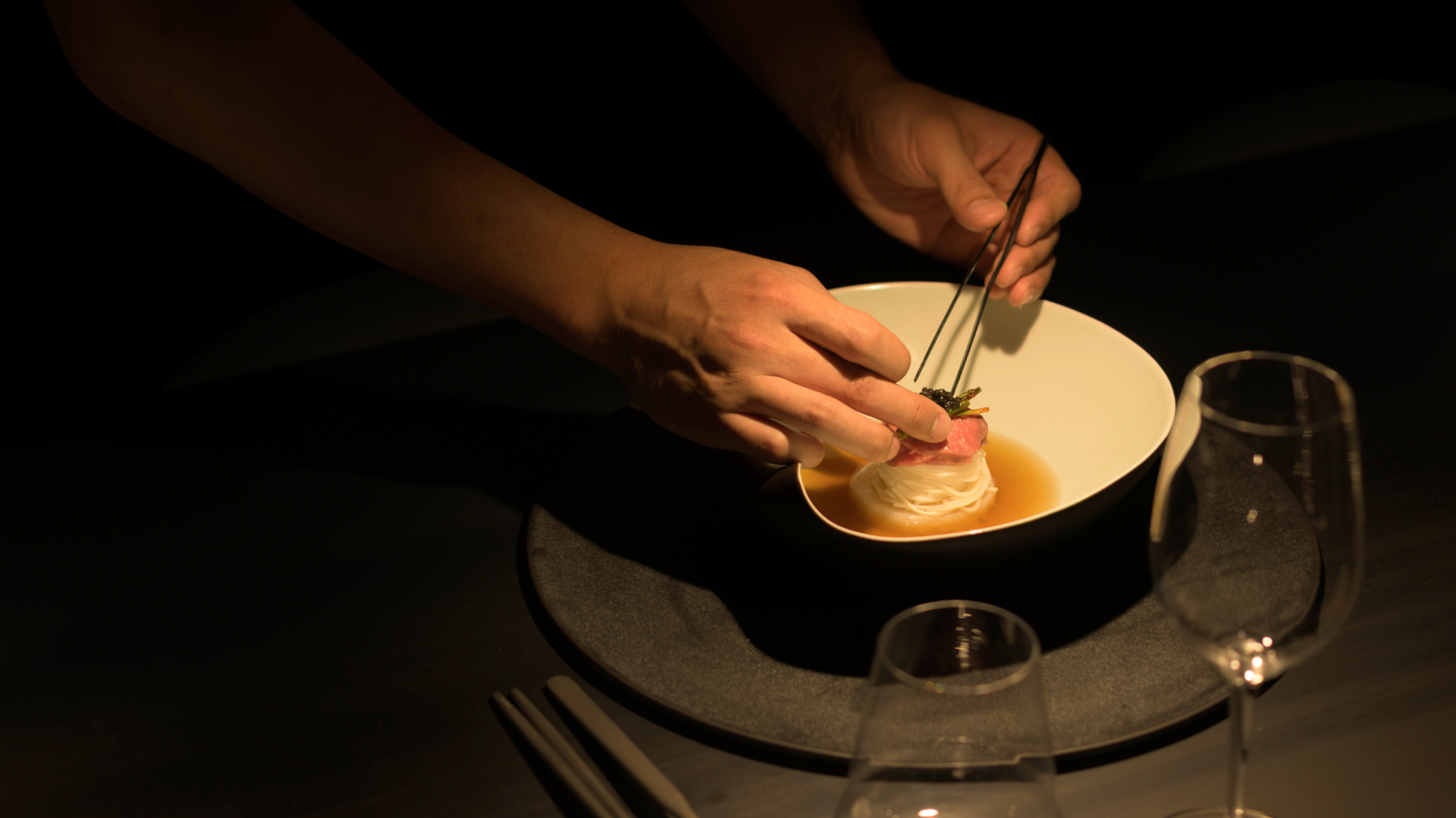 Chef Andy Choi delicately plating a noodle dish at exciting new Brisbane Korean restaurant Suum