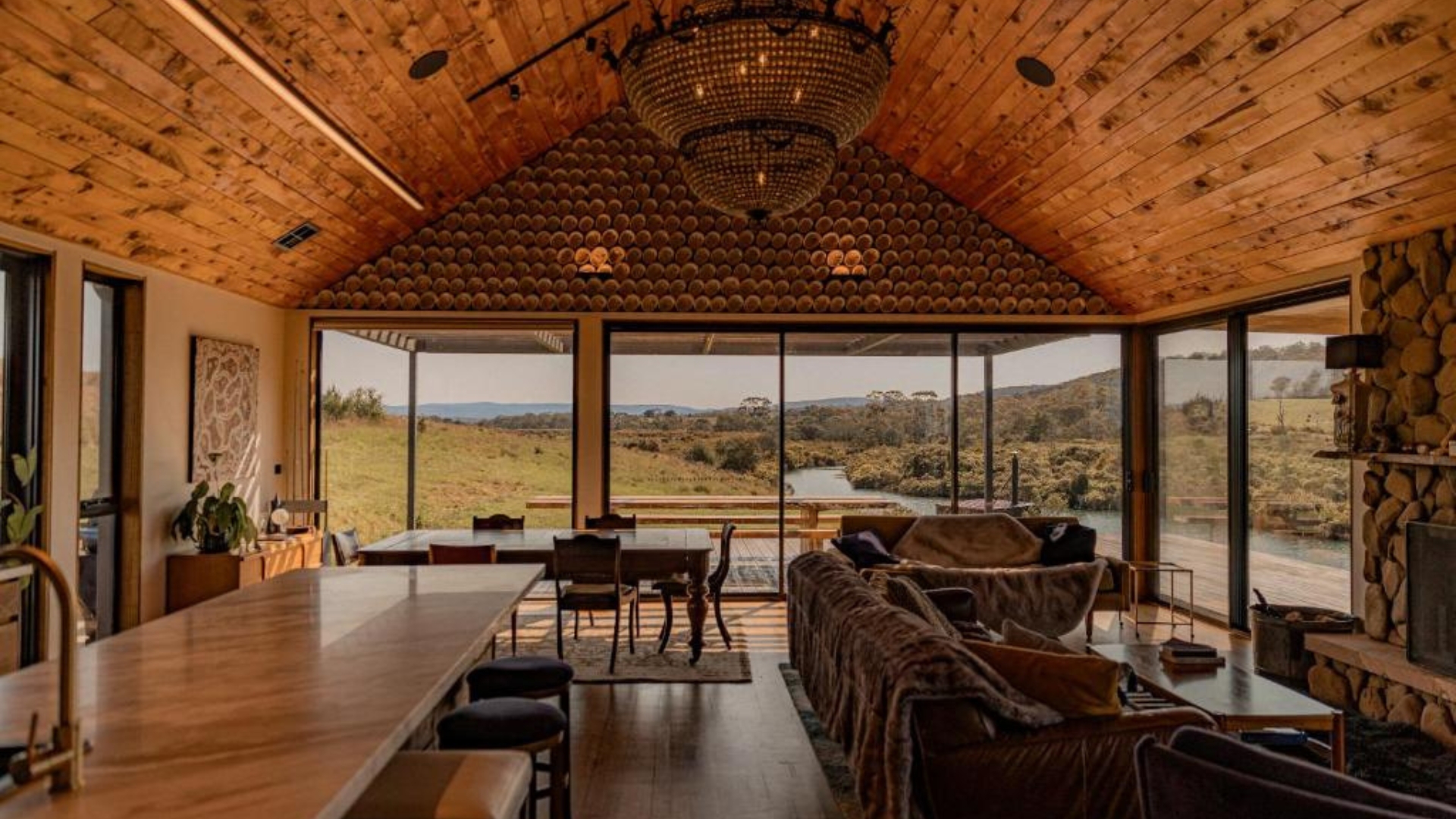 Warm timbers, floor-to-ceiling windows and a fireplace make for the ideal setting to take in the Swan River at Swan River Sanctuary in Swansea 