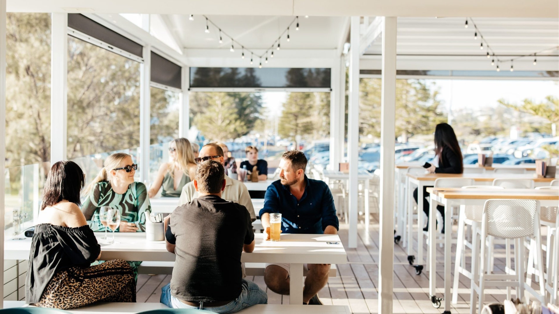 A sun-drenched outdoor dining area at Bert's in City Beach, Perth 