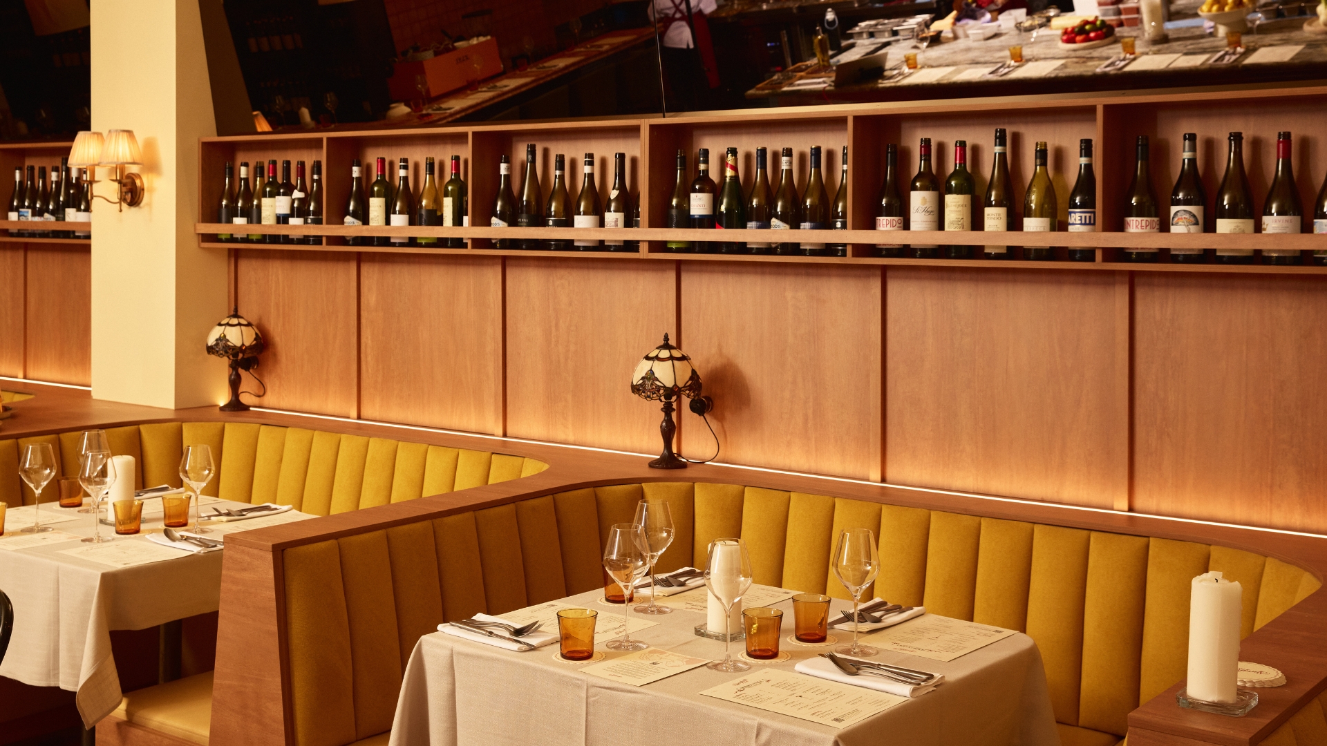 Sunshine-yellow booths, vintage lights and dark timber panelling set the scene at Richmond's Spaghetti Club 