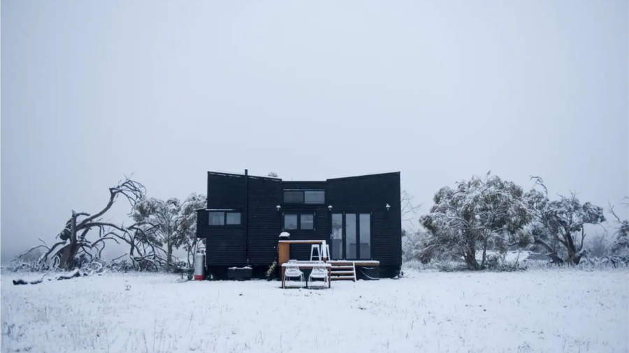 Jindabyne Airbnb with black exterior in snow