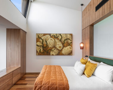 Luxury Adelaide hotel bedroom with painting and skylight at Sequoia Lodge in the Adelaide Hills