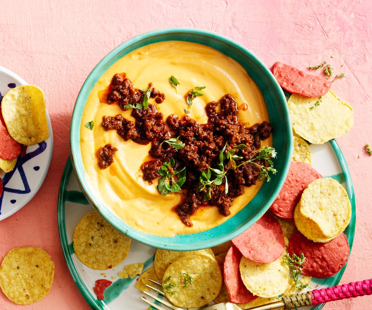 Vegan cheese dip (queso dip) with spizy vegan chorizo and corn chips